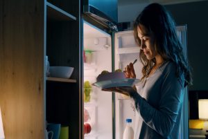 Happy,Hungry,Woman,Having,A,Midnight,Snack,,She,Is,Standing